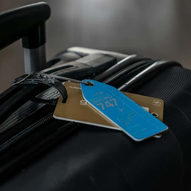 7. Novelty luggage tags with outdated contact info (Image Credits: Unsplash)