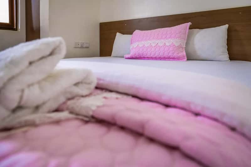 2. That folded bedspread is not washed nearly as often as you think (Image Credits: Unsplash)