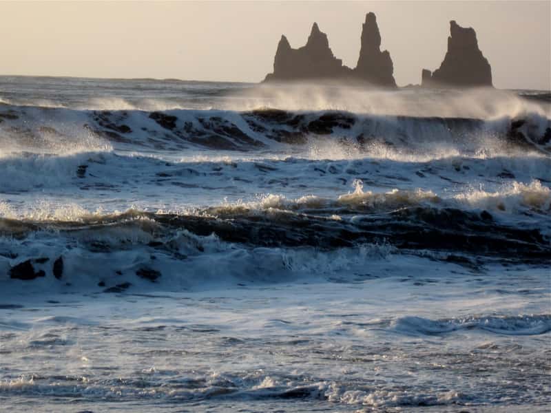 Vik, Iceland – Black Sand and Sea Stacks (Image Credits: Wikimedia)
