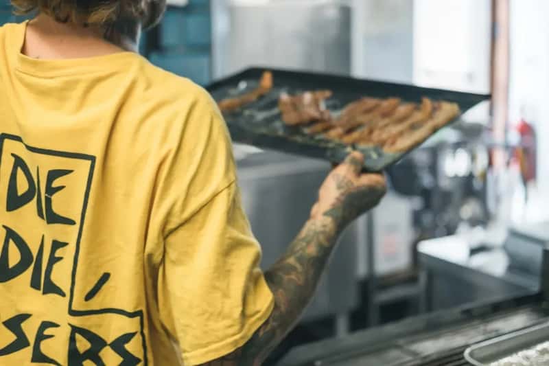 #13 - Never Cook in Loose, Flowing Clothing or Dangling Fabric Near the Stove (Image Credits: Unsplash)