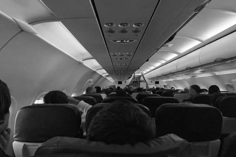 1. Long-haul flights in a middle seat (Image Credits: Pexels)