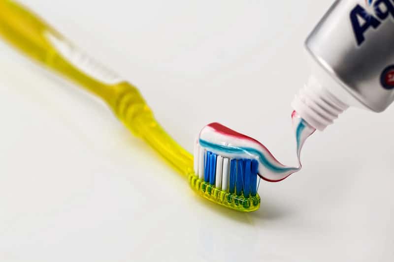 A Toothbrush and Travel Size Toothpaste (By Steve Buissinne, South Africa, CC0)