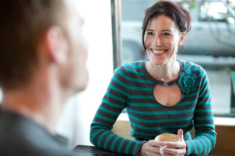 5. Striking up friendly conversations with strangers (Image Credits: Pixabay)