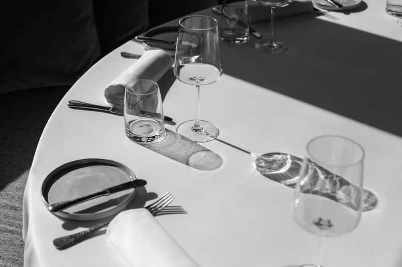 1. They confirm their table assignment on day one (Image Credits: Unsplash)