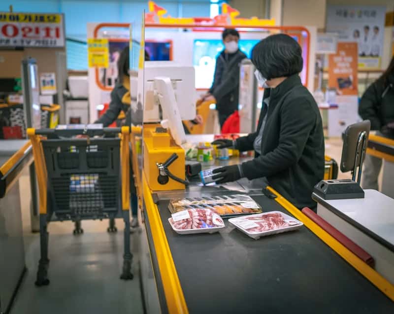 2. Assuming Someone Will Bag Their Groceries (Image Credits: Unsplash)
