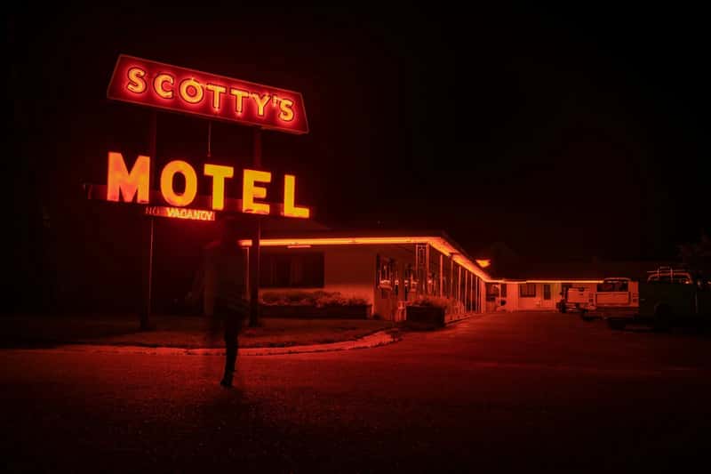 3. Calling ahead to book a motel with an actual phone call (Image Credits: Unsplash)