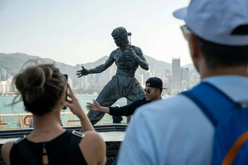 5. Posing on Statues and Blocking Sights for the Shot (Image Credits: Unsplash)