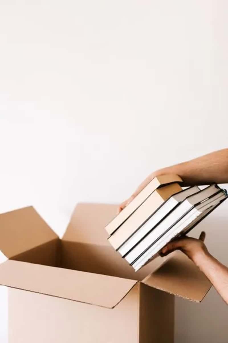 7. Packing heavy books instead of digital alternatives (Image Credits: Pexels)