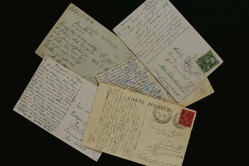 6. Sending postcards home to relatives and neighbors (Image Credits: Unsplash)
