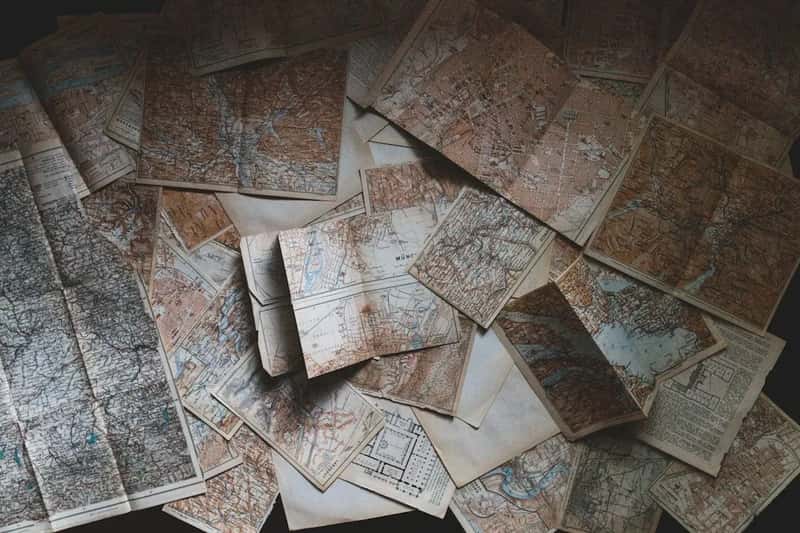 Paper maps and travel atlases (Image Credits: Unsplash)