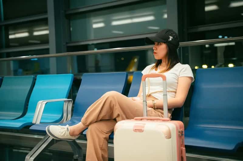 4. Dress like a frequent, low-maintenance traveler (Image Credits: Pexels)