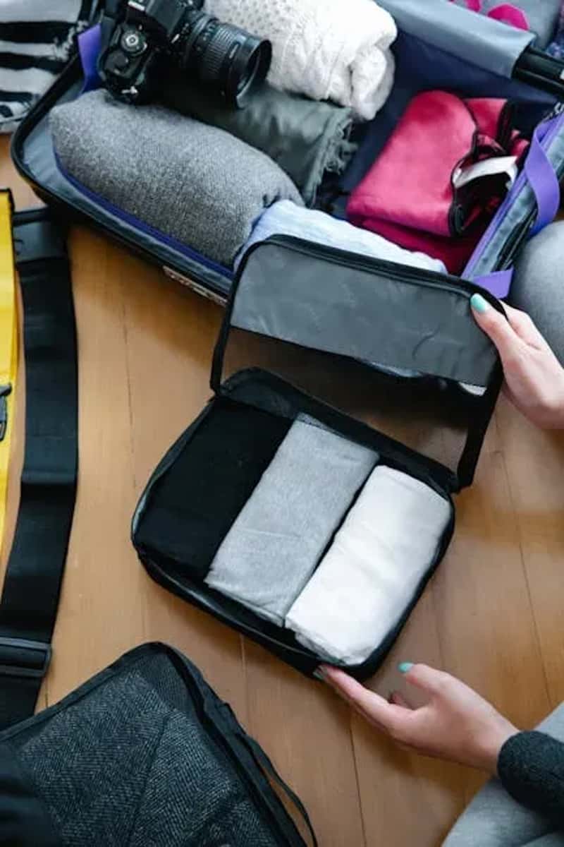 #9 - Use Packing Cubes as Your Suitcase's Drawer System (Image Credits: Pexels)