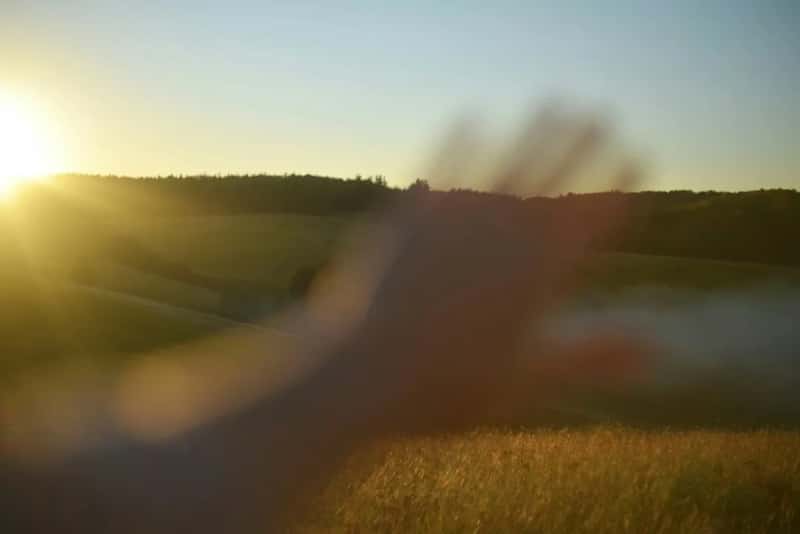 1. Waving at every car that passes on a rural road (Image Credits: Unsplash)