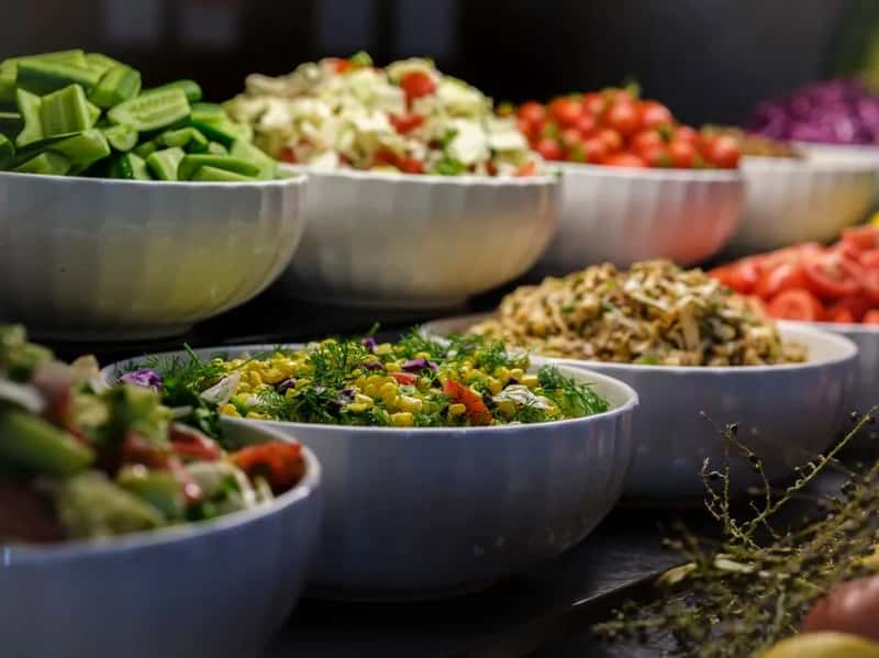 3. Pre-Cut Salads Sitting in the Buffet Line (Image Credits: Pexels)