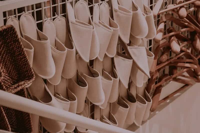 #12 - They Pack a Hanging Shoe Organizer and Turn the Cabin Door Into a Storage Wall (Image Credits: Unsplash)
