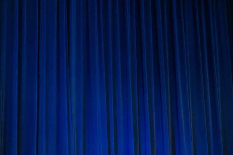 Sheer curtains standing in for real blackout drapes (Image Credits: Unsplash)