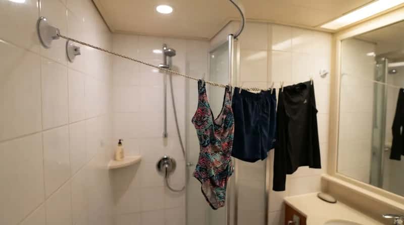 #15 - Pack a Suction-Cup Clothesline for the Bathroom (Image Credits: Gemini)
