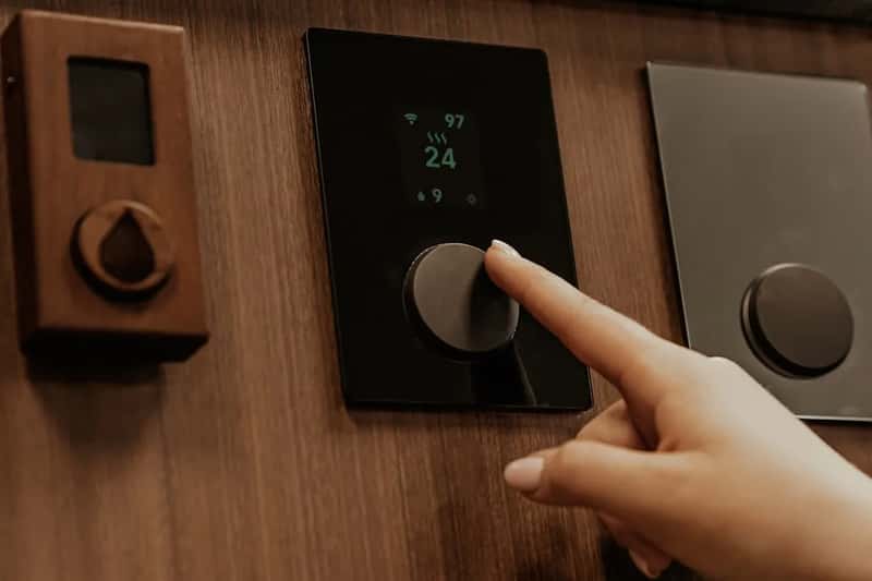 They adjust the thermostat before unpacking a single bag (Image Credits: Unsplash)