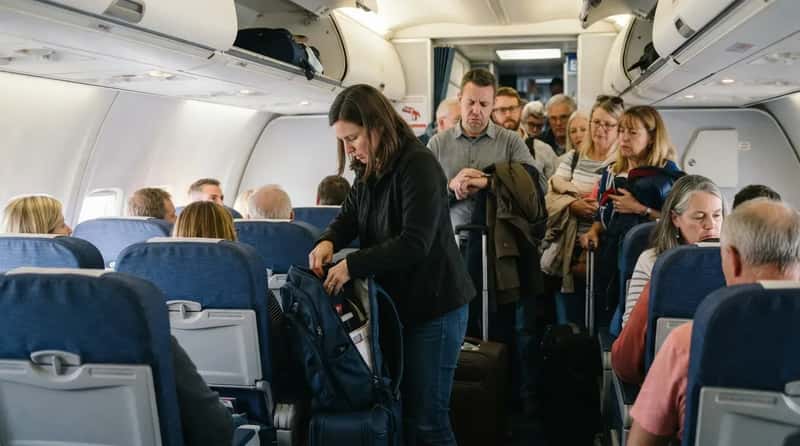 #6 - Digging Through Your Backpack in the Middle of the Aisle (Image Credits: Gemini)