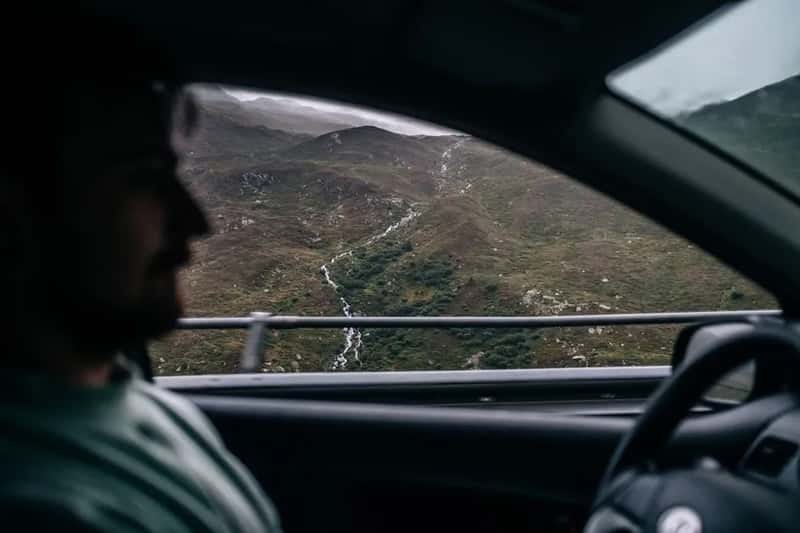 2. Being a passenger on winding mountain roads (Image Credits: Pexels)