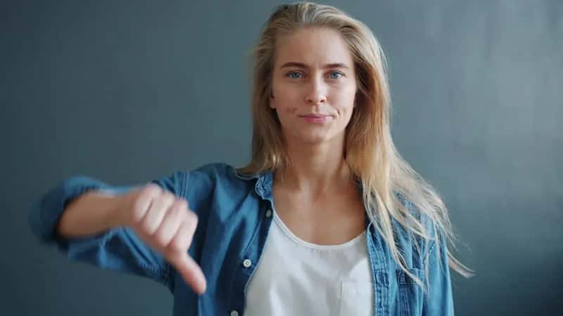 Giving the Thumbs Down Gesture (Image Credits: Unsplash)