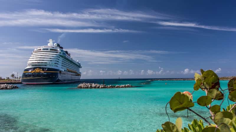 Anchored Disney Cruise Line ship called Dream picture taken from its far back on Castaway cay, Bahamas with beautiful aqua color Caribbean waters and deep blue sky and white clouds on November 7 2016.