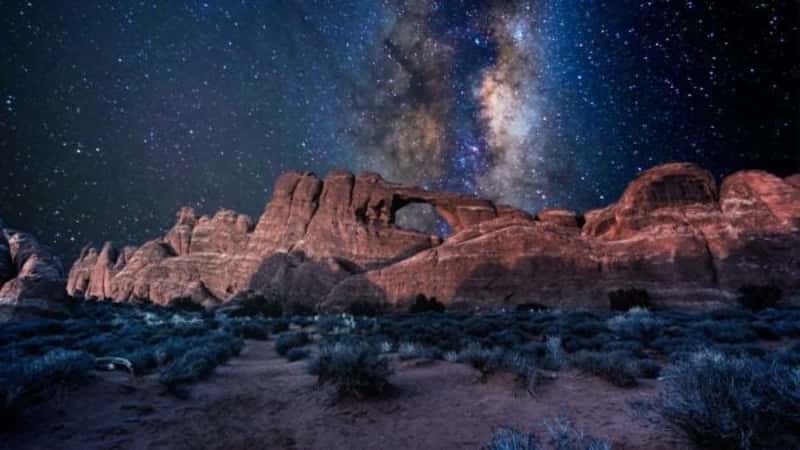 Arches National Park under a milky way star filled night sky in Moab, Utah USA.