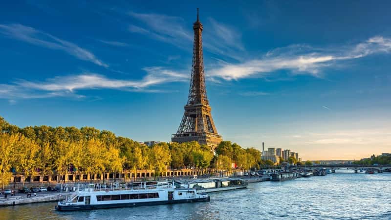 Eiffel Tower by the Seine River in Paris at summer. France. River Cruise