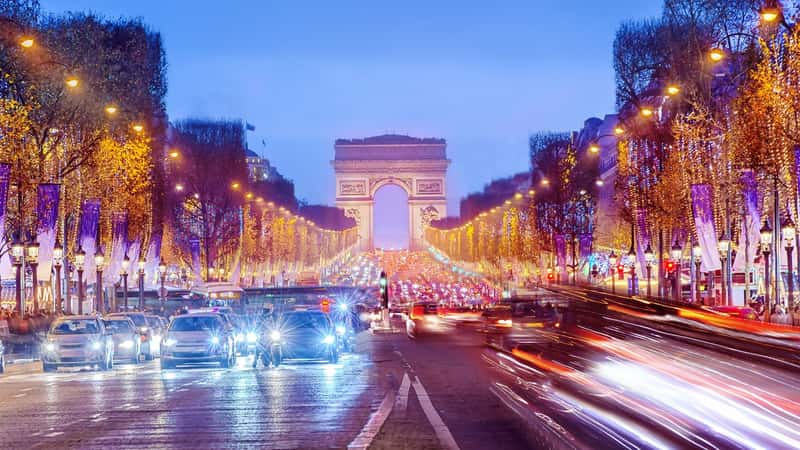 Arch of Triumph and Champs Elysees in Paris at night, France