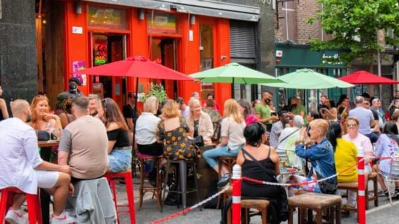 crowds outdoor dining on Parliament Street, Dublin, Ireland