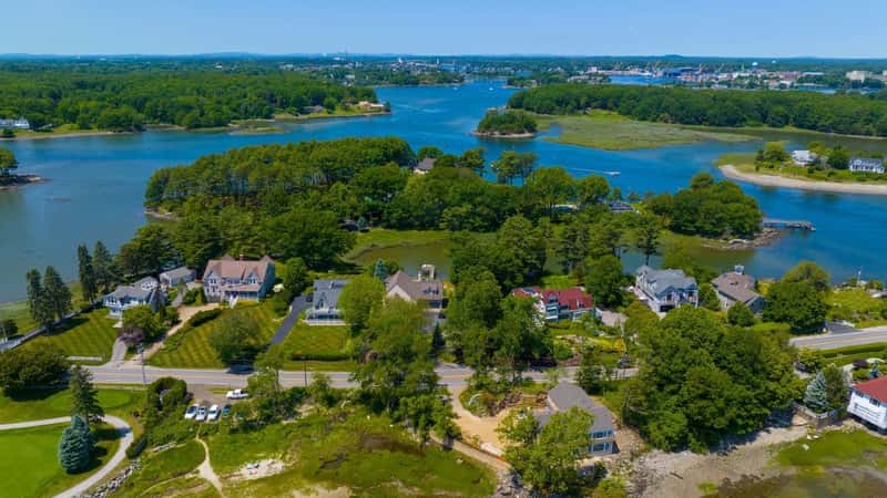 Historic waterfront house aerial view at the mouth of Piscataqua River in town of Rye with New Castle town at the background, New Hampshire NH, USA. 