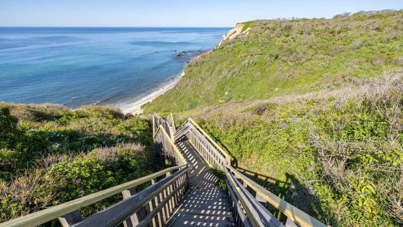 Long wooden staircase leading down to the beach at Mohegan Bluffs, Block Island, Rhode Island, USA
