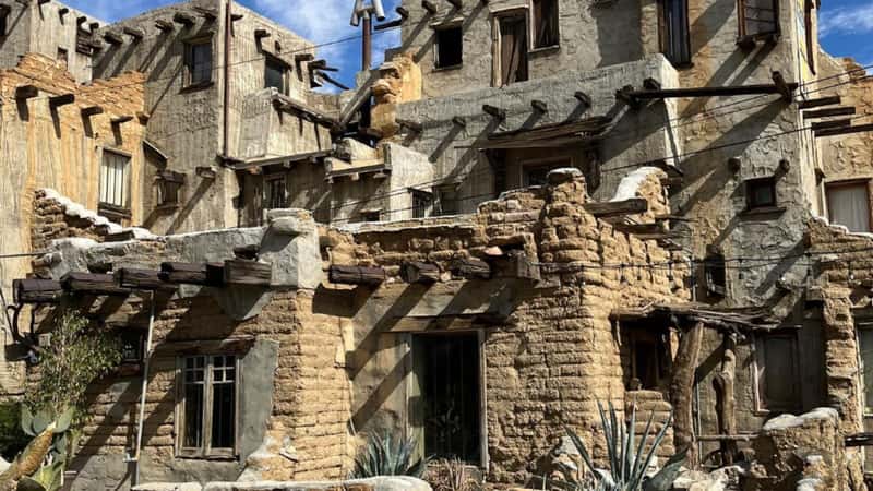 Cabot's Pueblo Museum is a remarkable architectural gem nestled in the desert landscape of Desert Hot Springs, California. Its exterior is characterized by rugged adobe walls, intricate wooden detailing, and a towering four-story turret.