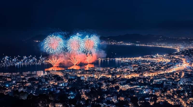 Arial night shot of the beaches of Cannes France during their famous fireworks festival.