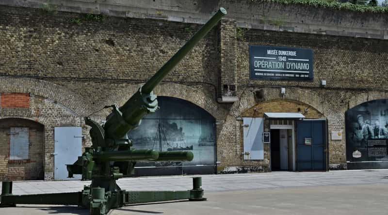 Dunkirk Museum entrance with a giant WWII cannon mounted out front.