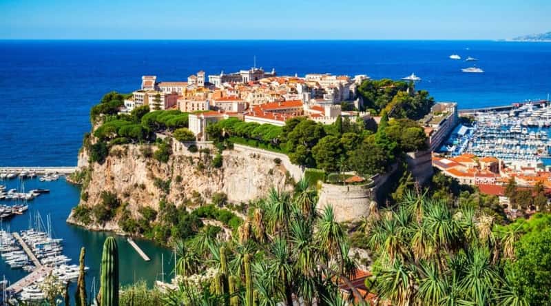 Captivating aerial view of Old Town Monaco, French Riviera, showcasing charming historic architecture, narrow cobblestone streets, and the Mediterranean Sea in the background.