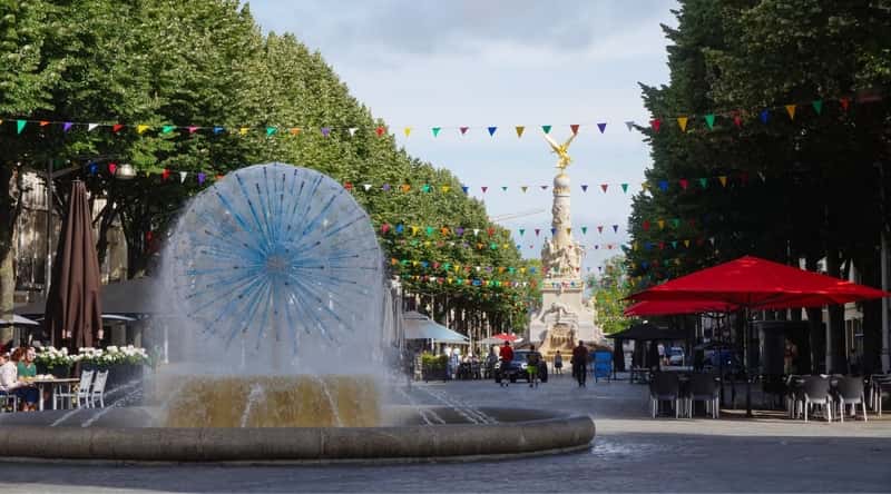 View of the Place Drouet d’Erlon, with the famous Sube fountain in the foreground and the Winged Victory Statue in the background.