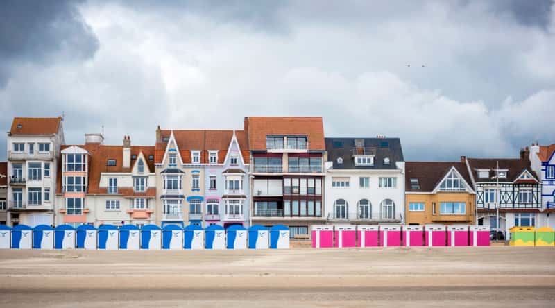 The Gravelines resort beach in Dunkirk, France, on a cloudy day, photographed from a distance looking back towards the land.