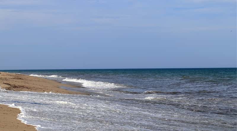Siasconset Beach, located on Nantucket Island in Massachusetts, is a secluded beach known for its picturesque beauty and calm waters.