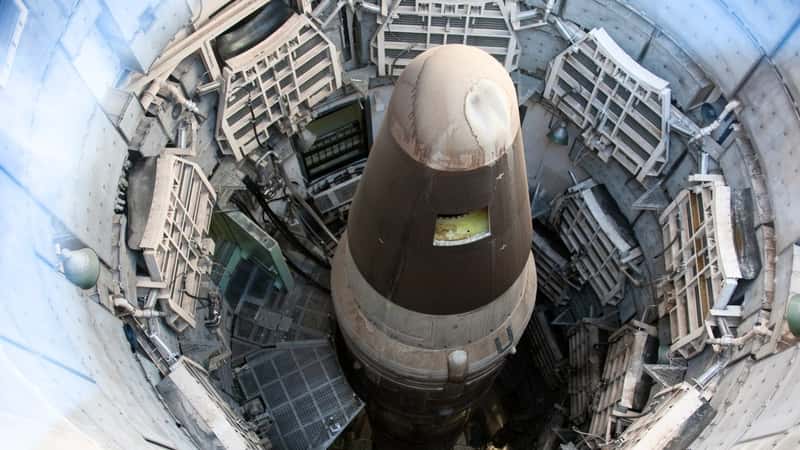 The image depicts the Titan II Intercontinental Ballistic Missile (ICBM) standing tall within its missile silo in Sahuarita, Arizona. 