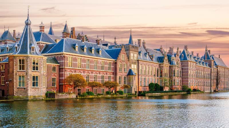 The Hague, Ridderzaal in Binnenhof with the Hofvijver lake at sunset. Meeting place of States General of the Netherlands, the Ministry. Office of the Prime Minister of Netherlands.
