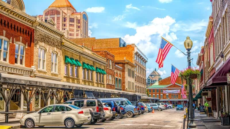 Small Town quaint USA main street hometown commercial storefront shops with flag in downtown Roanoke Virginia