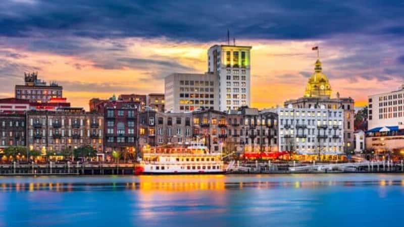 Savannah, Georgia, USA skyline on the Savannah River at dusk.