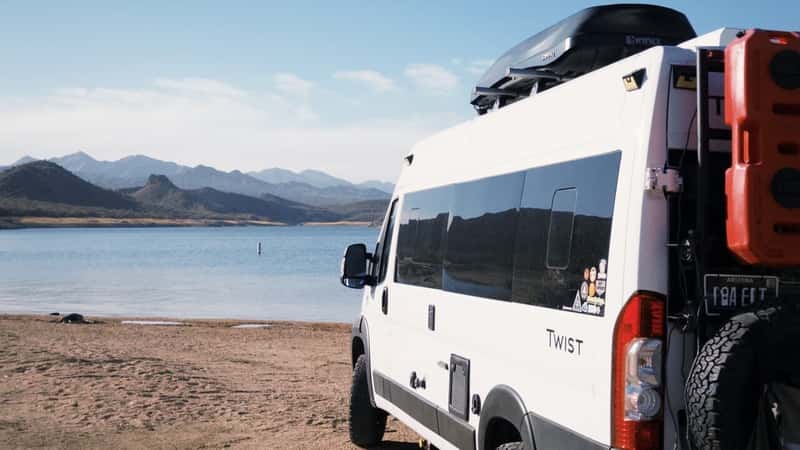 a white van parked on a beach