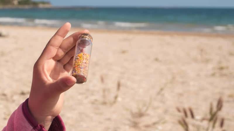 A jar of sand at the beach.