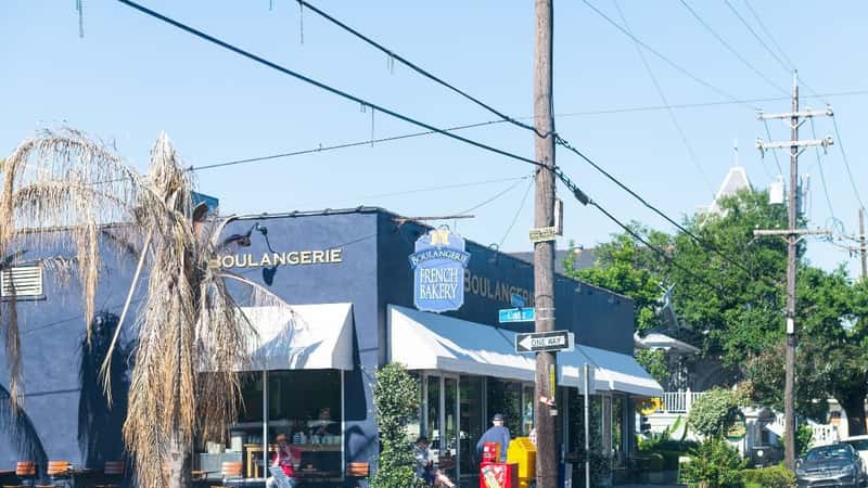 New Orleans, USA - April 23, 2018: Famous Magazine street in Garden district in Louisiana town city with La Boulangerie french bakery store shop