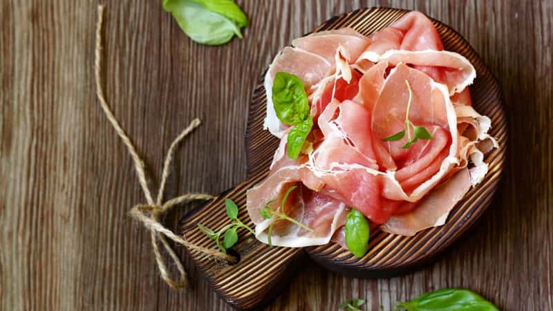 Parma italian dried ham on a wooden board
