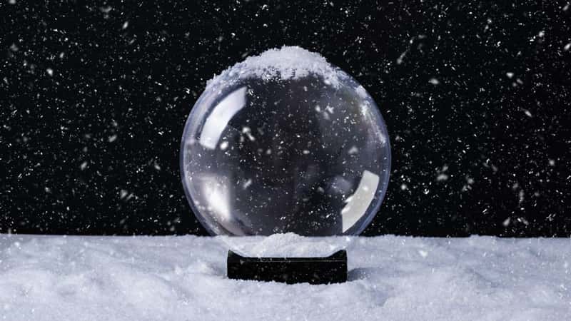 Christmas magical snow globe empty inside for your design. Christmas or New Year greeting card. Snow globe on snowy background.
