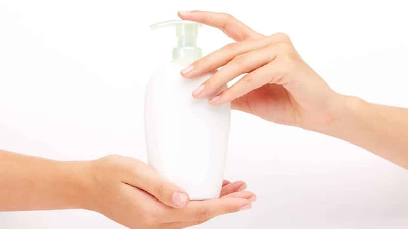 Female hands presenting liquid soap