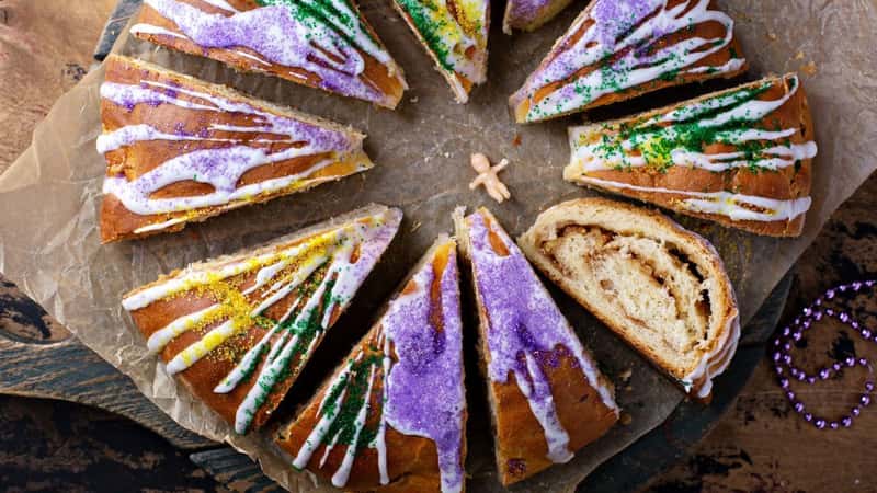 King cake for Mardi Gras, New Orlean traditional pastry with a plastic baby